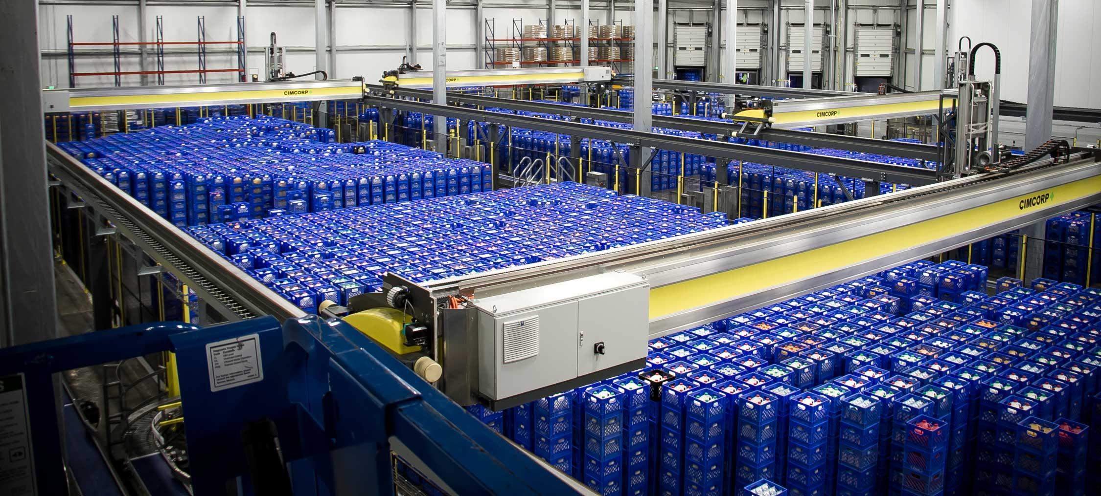 Four Cimcorp MultiPick gantry robots at Kroger's Mountain View Foods dairy facility, automating crate storage and picking for fresh milk distribution.