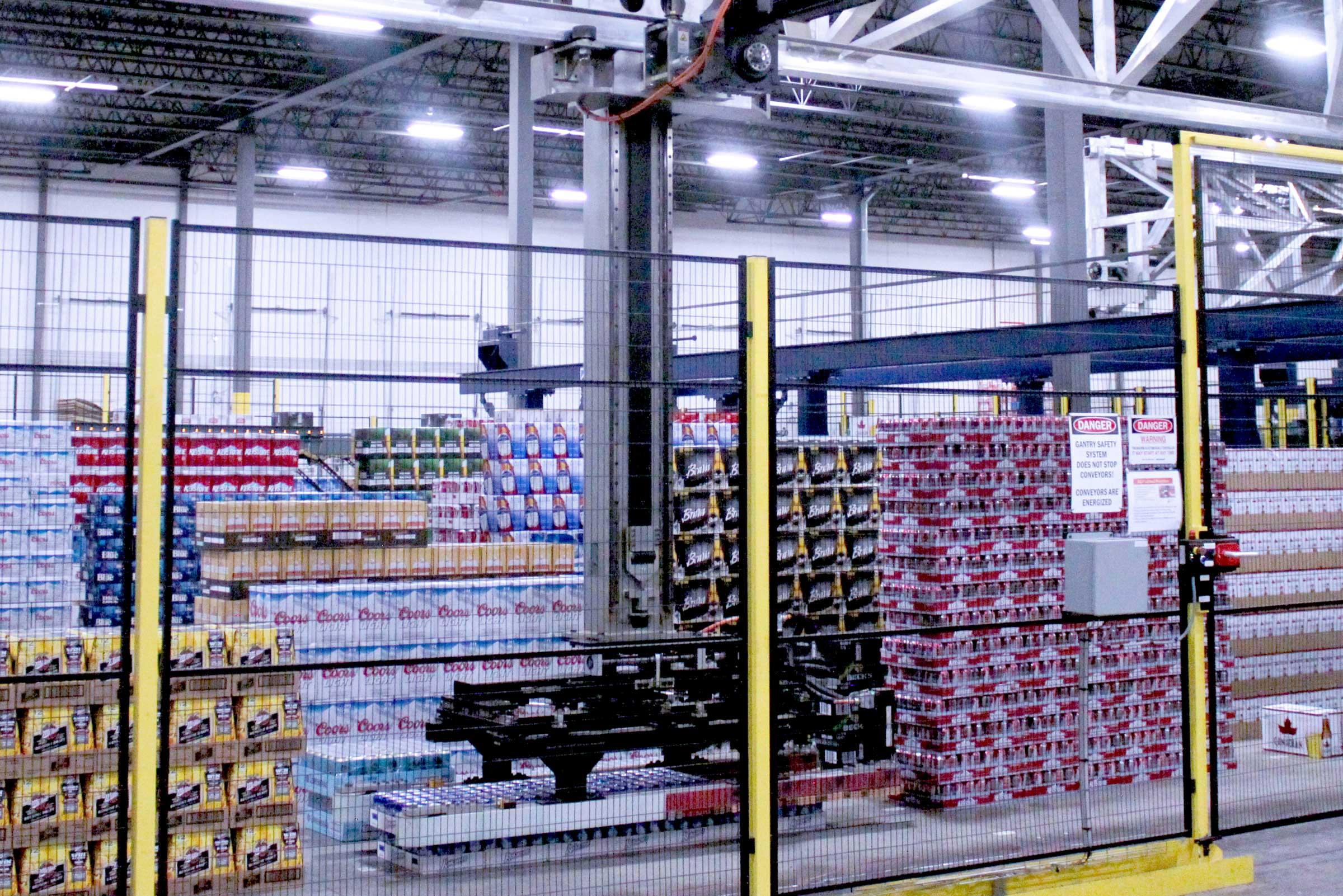 Mixed case pallets under layer picking robot by Cimcorp Group.