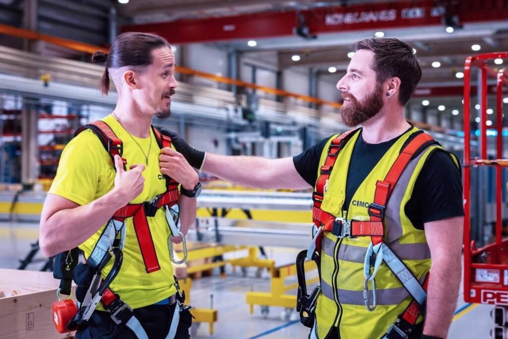 Safety harness on two people at Cimcorp Group